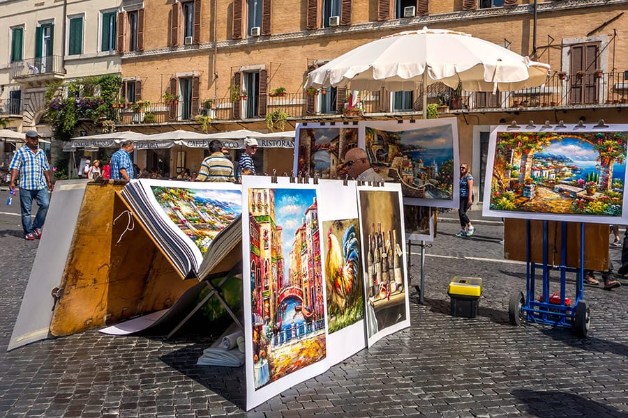 Man selling paintings in Rome Italy