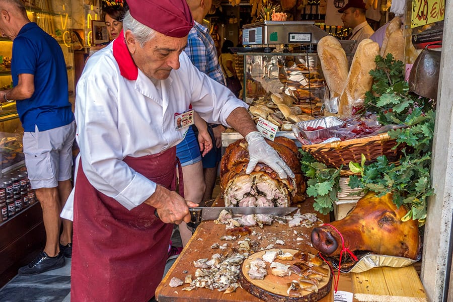 Man cutting Porchetta in Rome, Italy