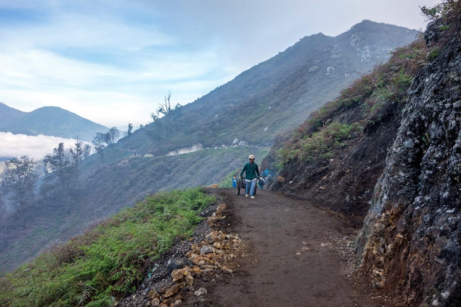 Miner carrying sulfur to the base camp of Mount Ijen