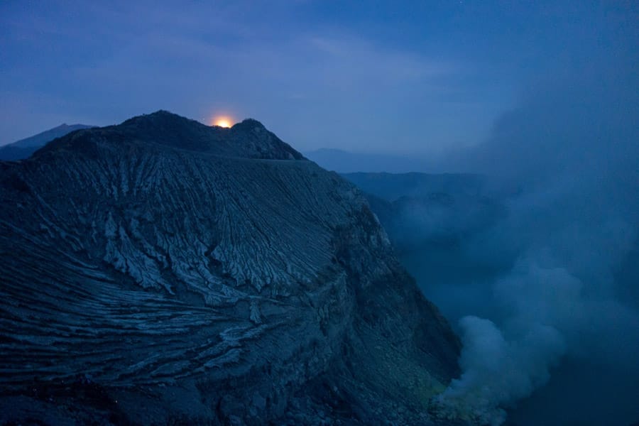 Moon shining over Mount Ijen