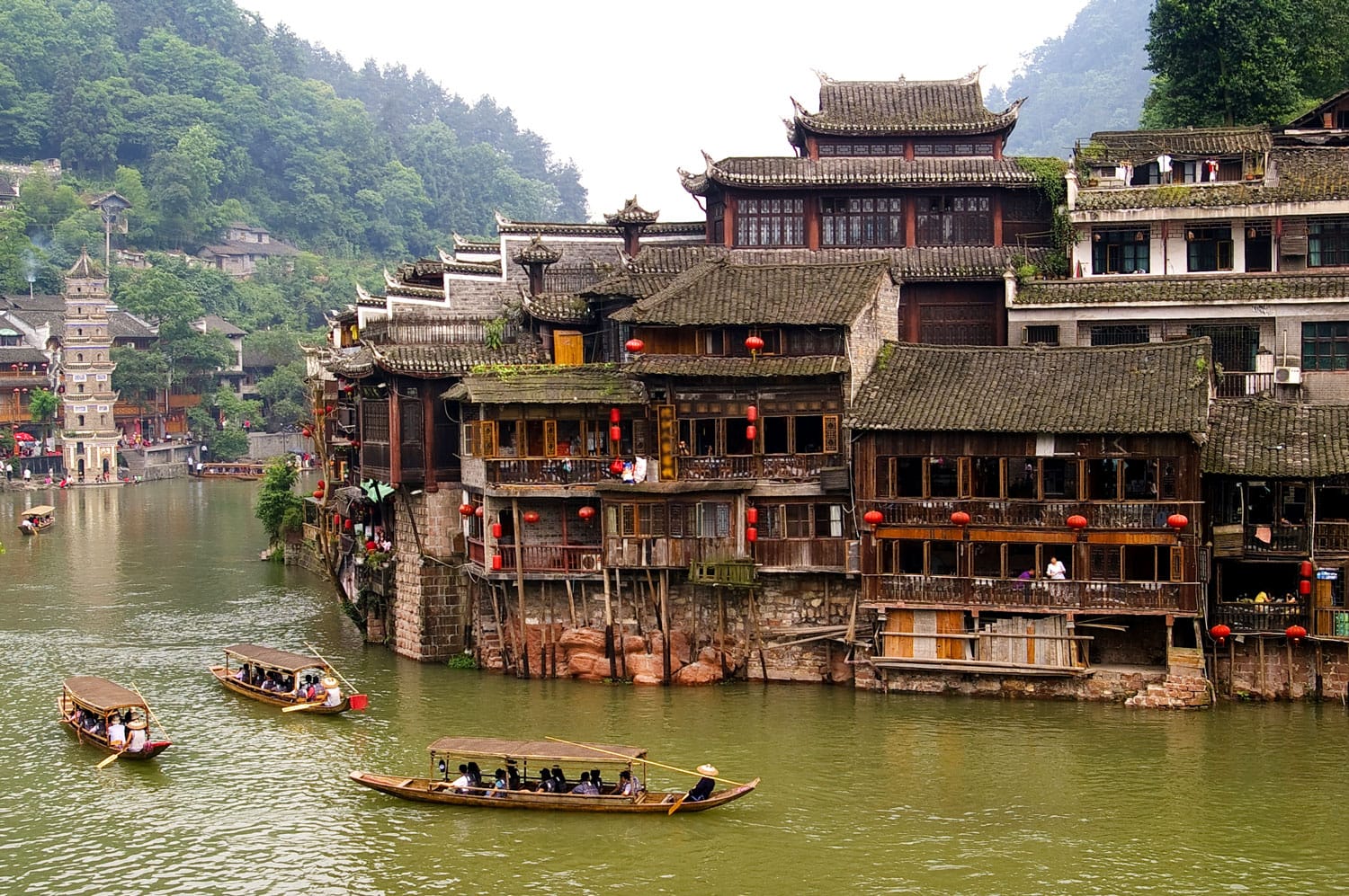 Boats and wooden houses at Phoenix Town - the one the four most attractive small towns in China, next to Tuojiang