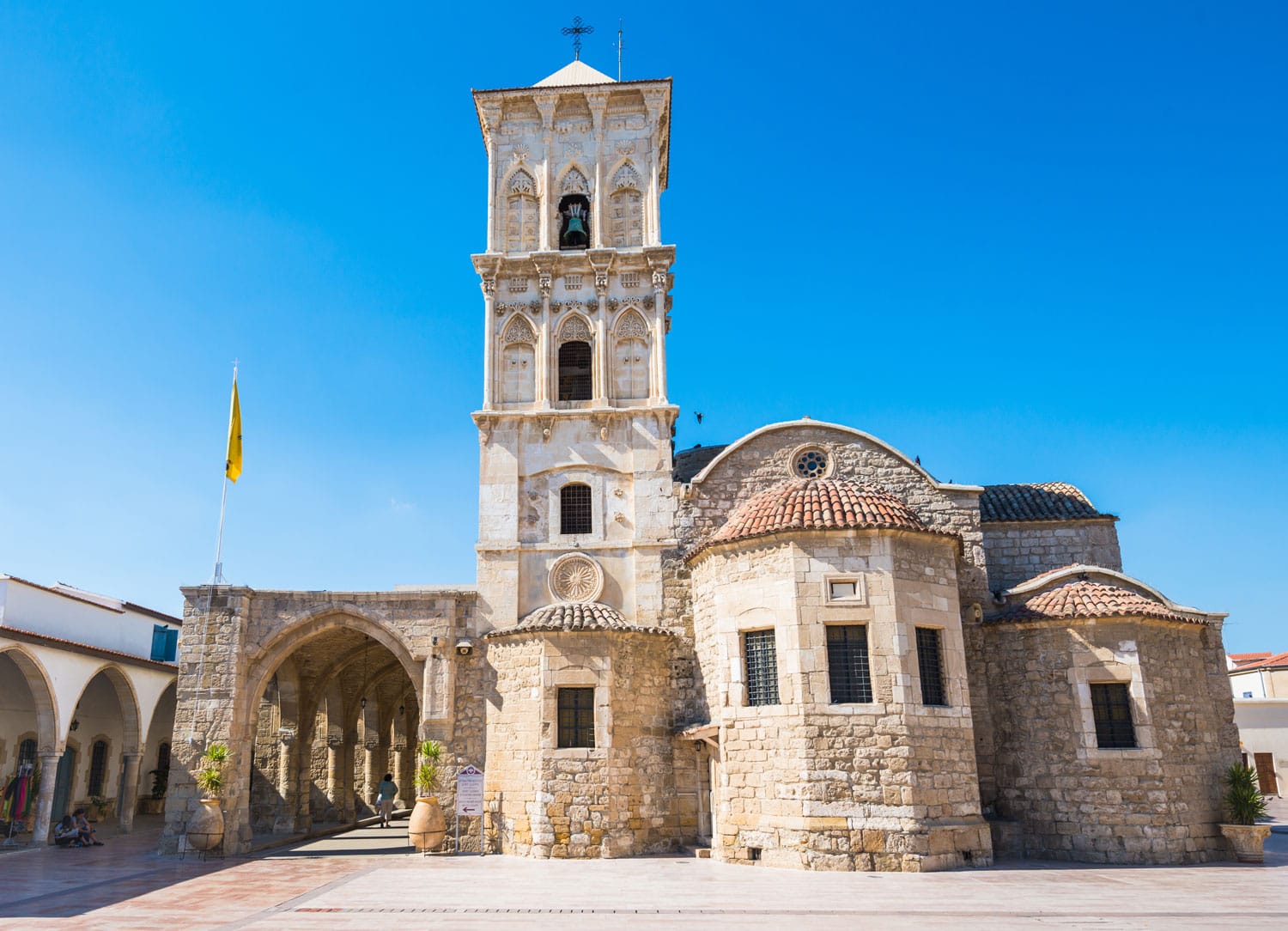 Orthodox church of Saint Lazarus in Larnaca, Cyprus sunny facade with beautiful decorations and blue sky background with soft focus