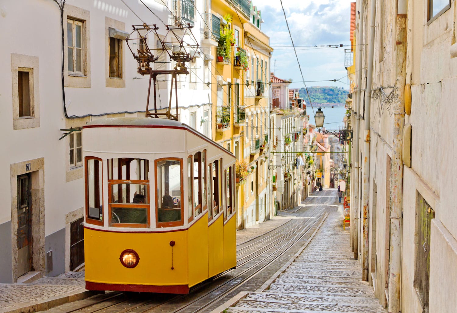 Lisbon's Gloria funicular classified as a national monument opened 1885 located on the west side of the Avenida da Liberdade connects downtown with Bairro Alto.