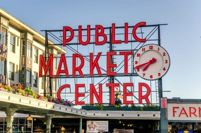 Pike Place Market Neon Sign at sunset in Seattle Washington.