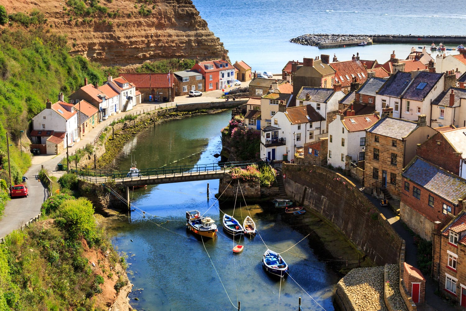 The classic view of Staithes, from a high viewpoint, showing the beck and the town