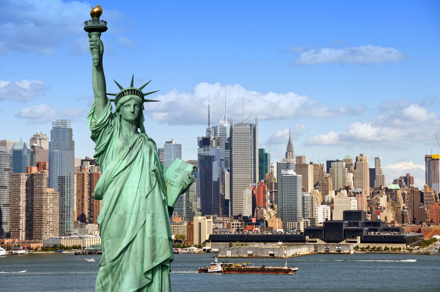 New York City skyline with Statue of Liberty over Hudson River