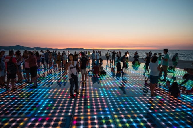Solar panels lit up at sunset in Zadar, Croatia