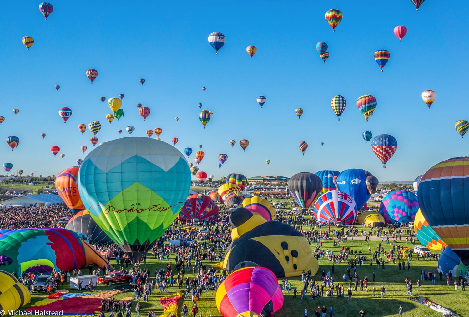 Mass ascension begins at the annual Albuquerque Balloon Festival.