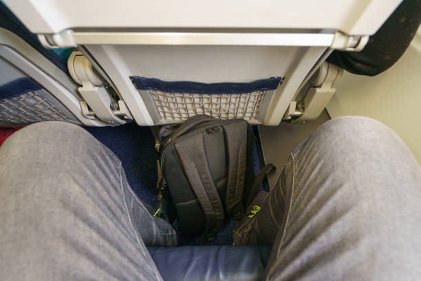 Interior of airplane with passengers on seats waiting to take off.