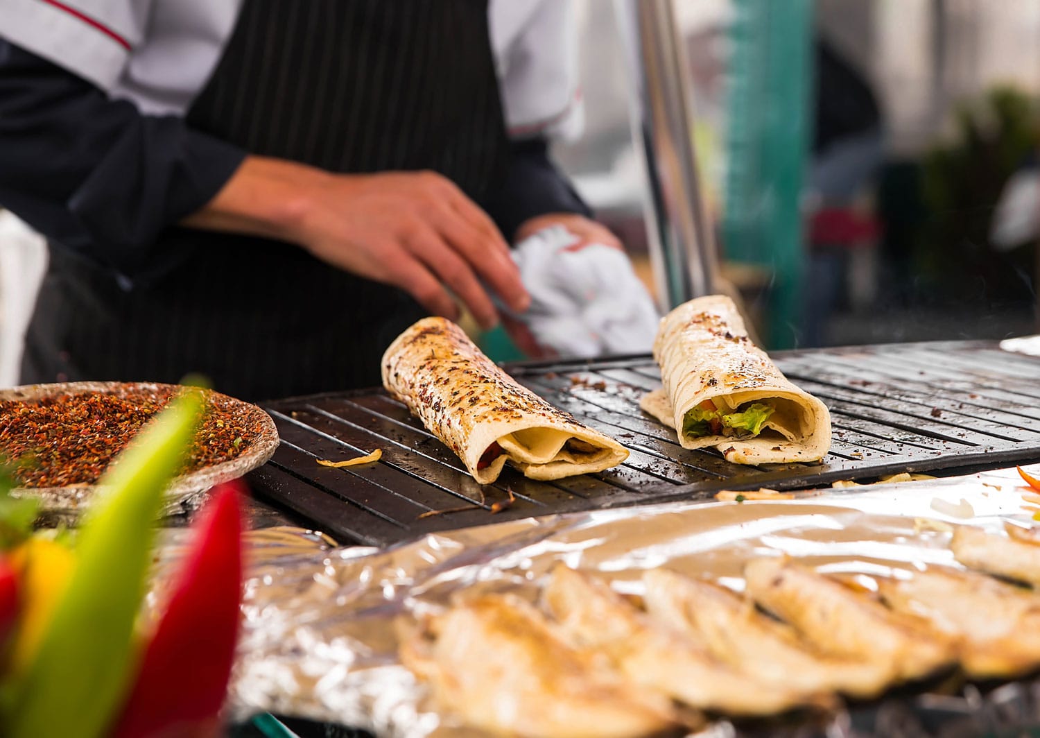 Vendor cooking salmon kebab Turkish bazaar in Istanbul
