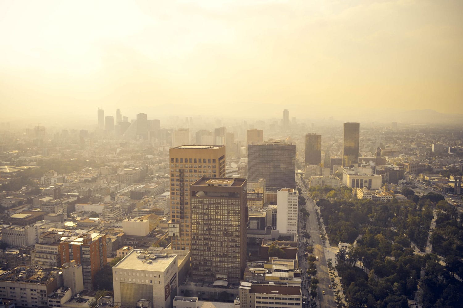 Mexico city industrial part covered in haze on sunset seen from the Latin American Tower, Mexico
