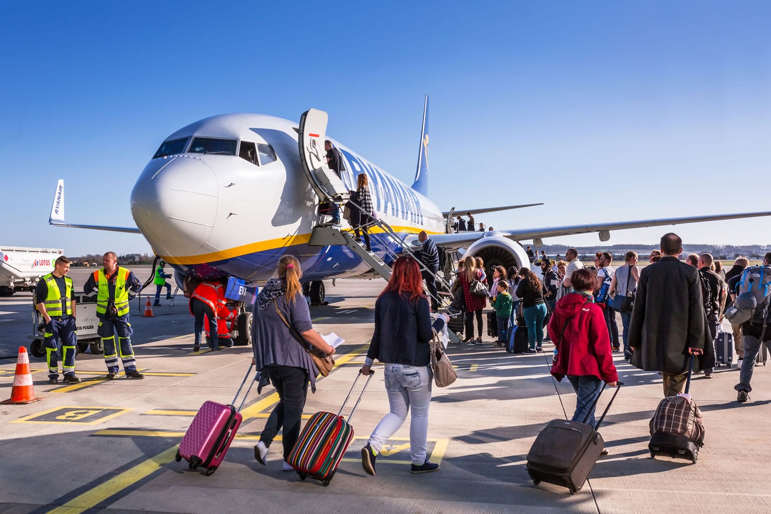 People boarding a plane