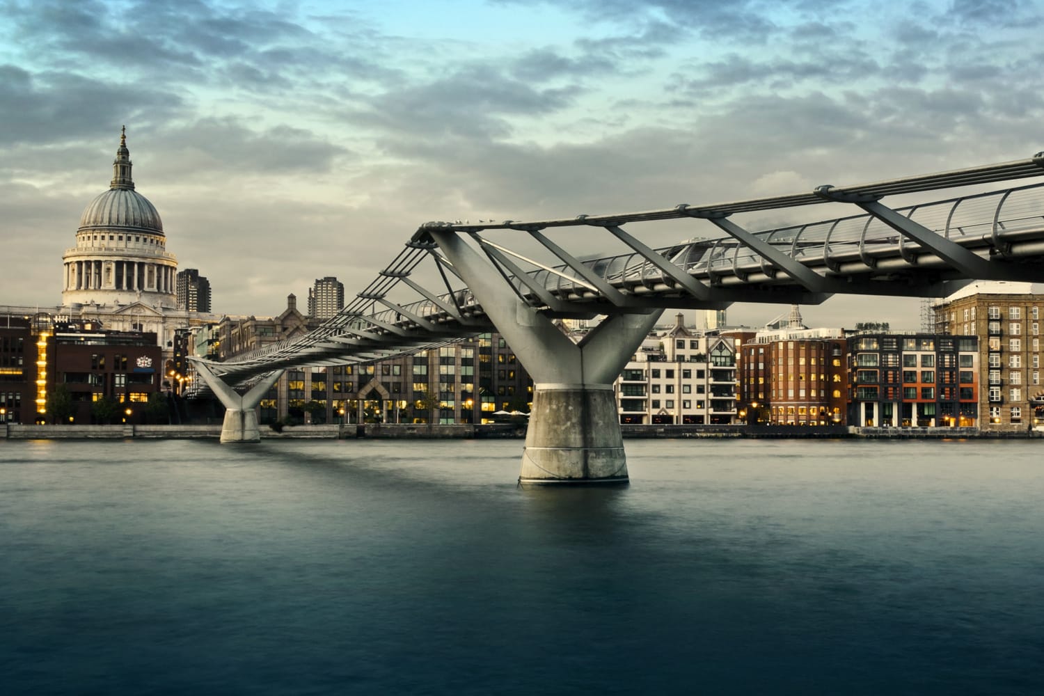 City of London, Millennium bridge and St. Paul's cathedral at twilight