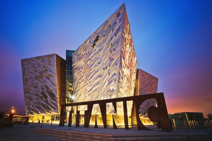 Sunset over Titanic Belfast - museum, touristic attraction and monument to Belfast's maritime heritage on the site of the former Harland and Wolff shipyard.