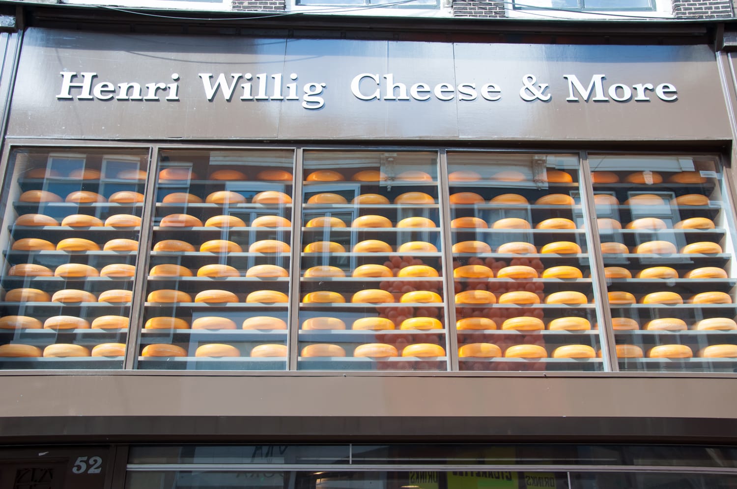 Various Dutch cheese displayed for sale in a local shop in Amsterdam.