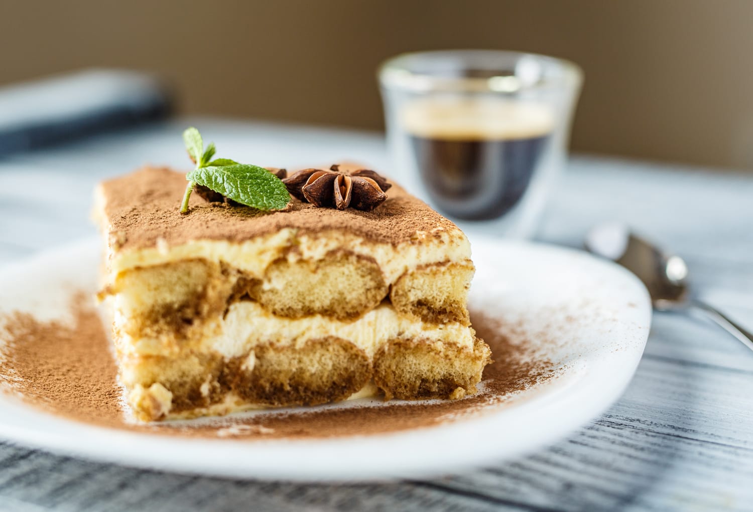 Delicious tiramisu on a wooden background