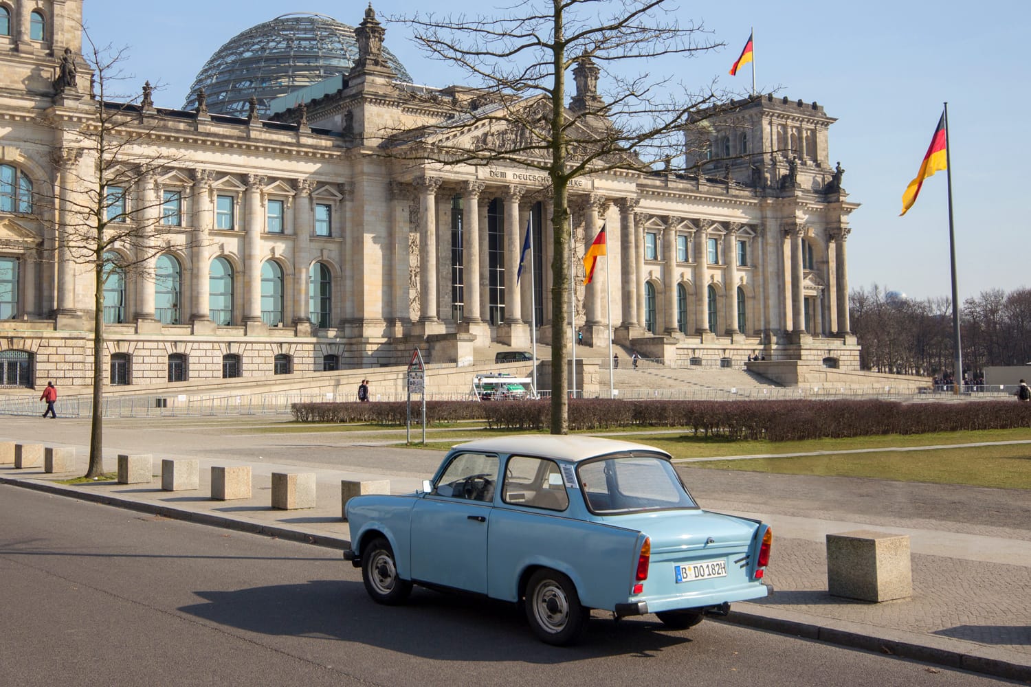 Trabi Car in front of the Reichstag Building in Berlin, Germany