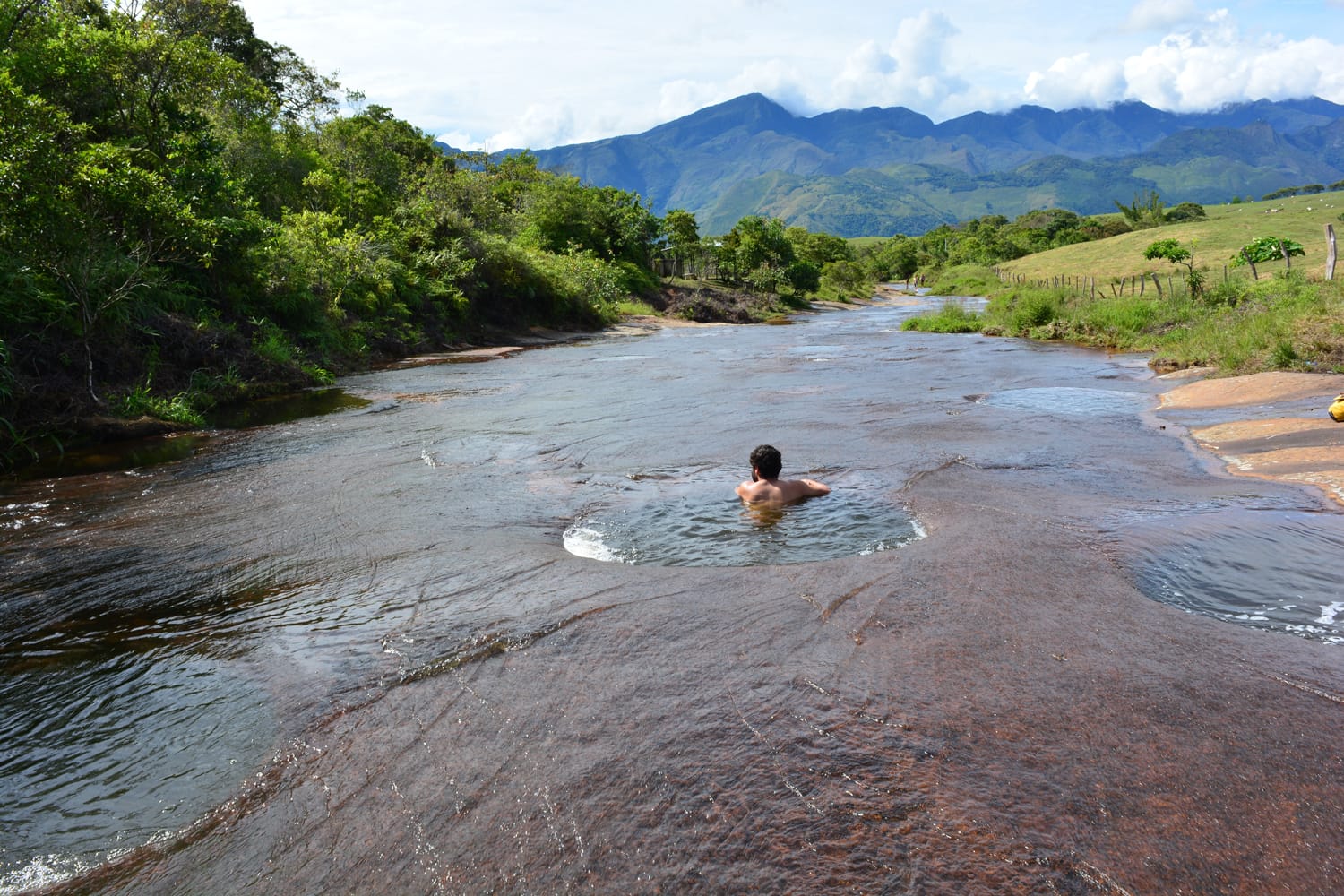Unidentified man bathing in las gachas river, near to Guadalupe colonial town, in Colombia