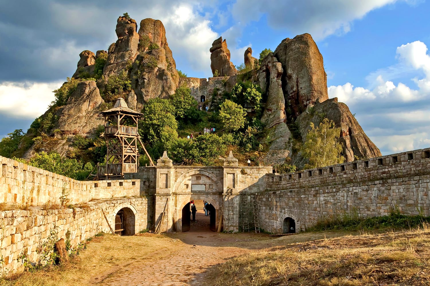 Belogradchik rocks Fortress in sunset cloudy sky, Bulgaria, Europe