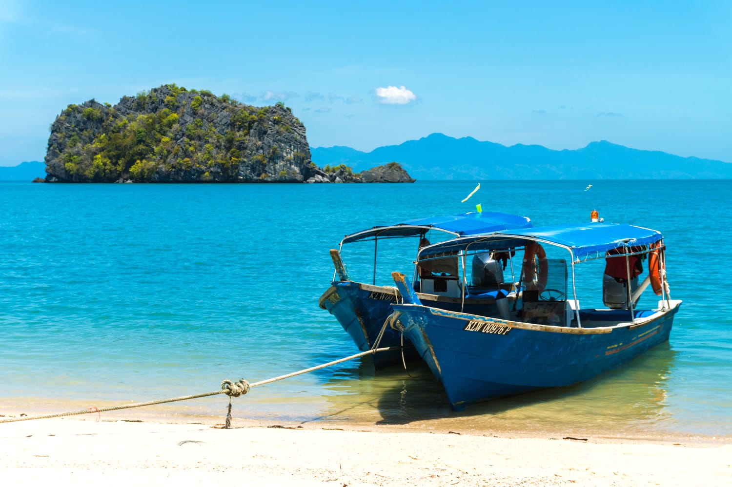 Boats for excursion on the beach on the island of Langkawi, Malaysia