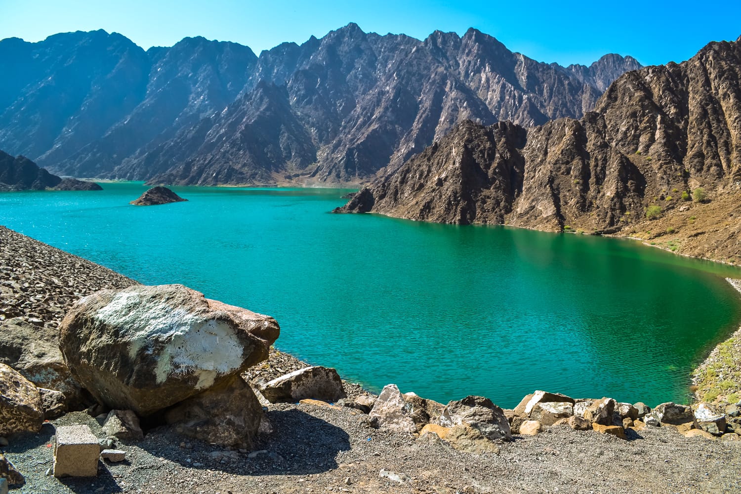 Hatta Dam Green Lake between mountains in Dubai, United Arab Emirates
