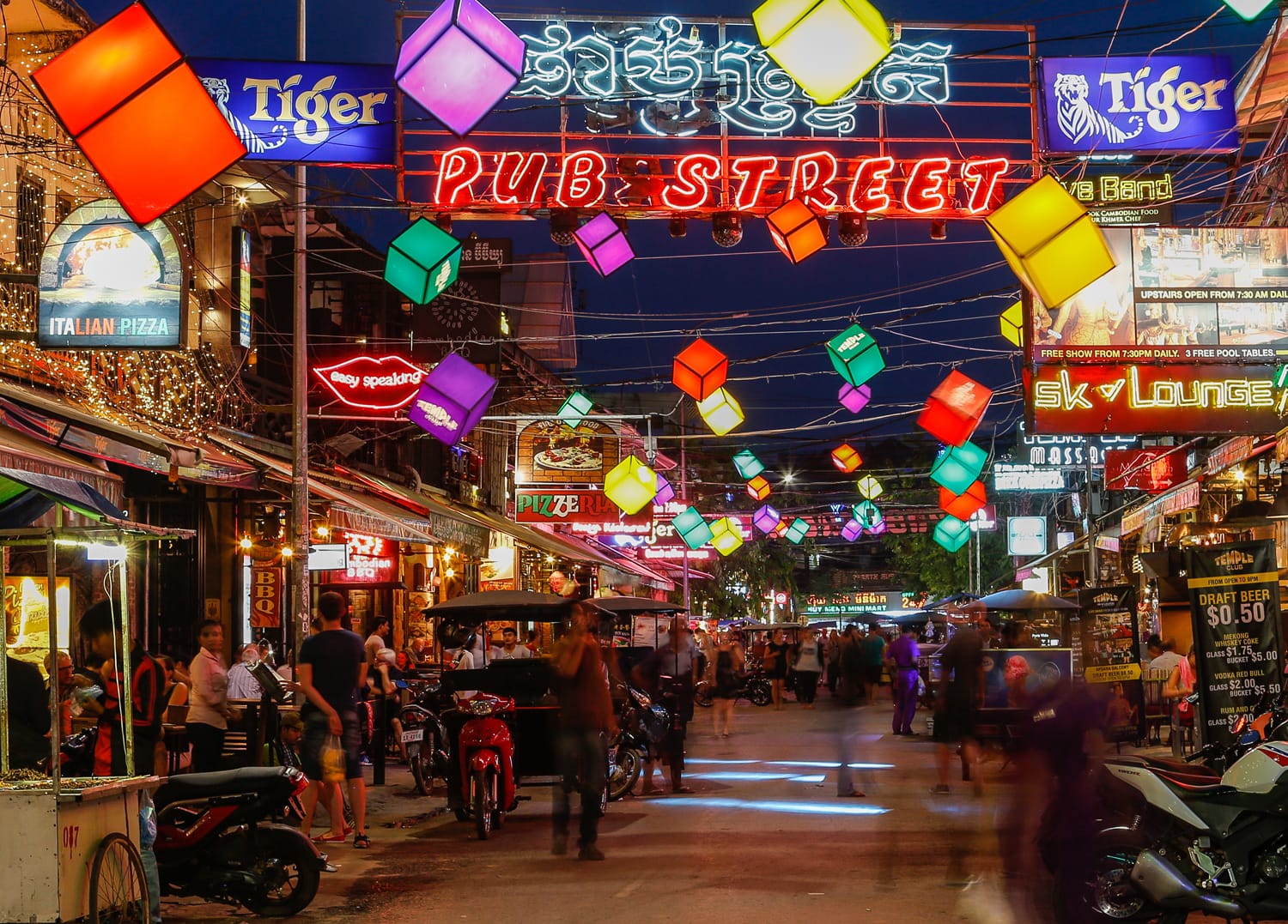 Bars, restaurants and lights along Pub Street in Siem Reap Cambodia at night