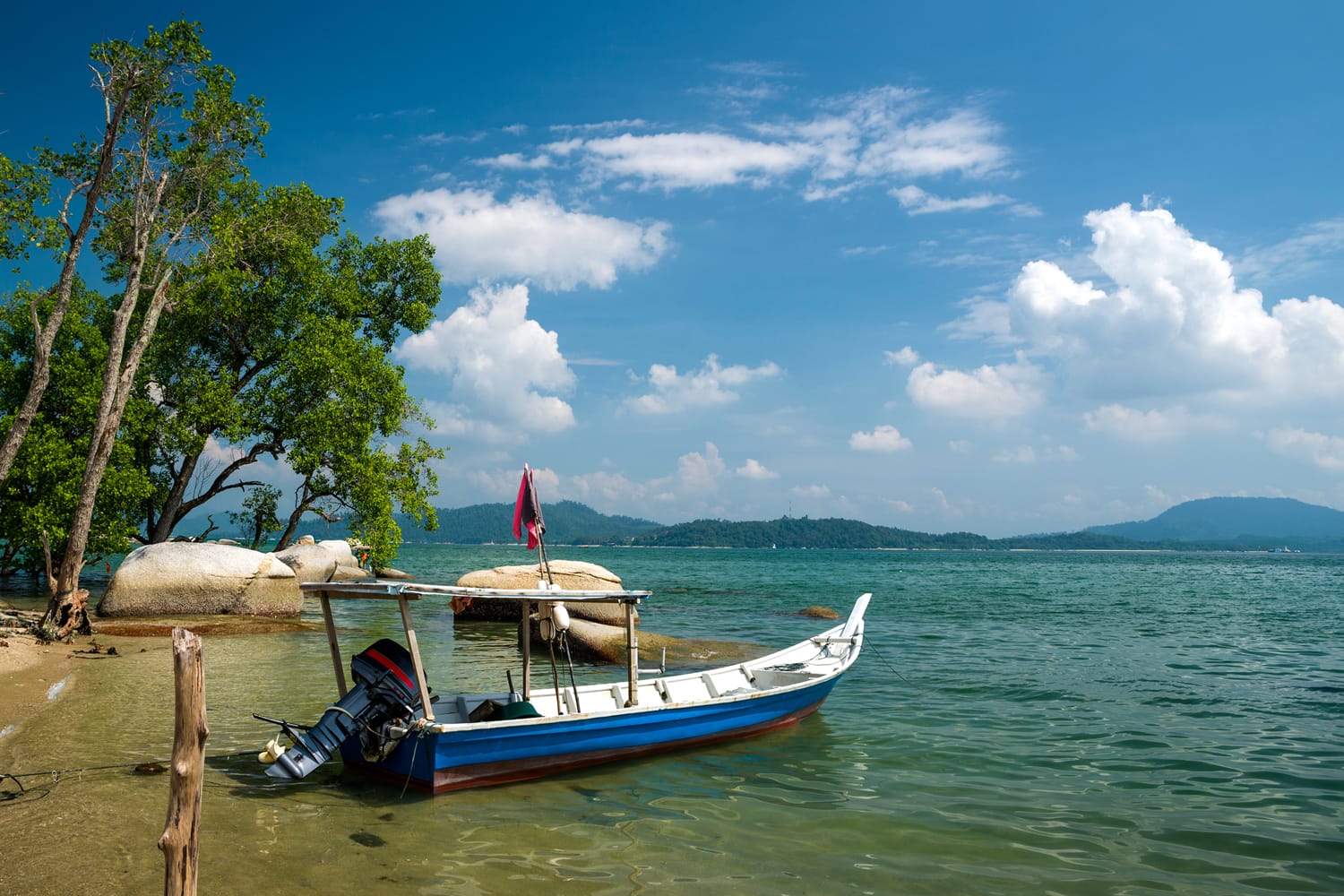 Fishing boat at the beach in Sungai Pinang Kecil, Pangkor Island, Perak, Malaysia