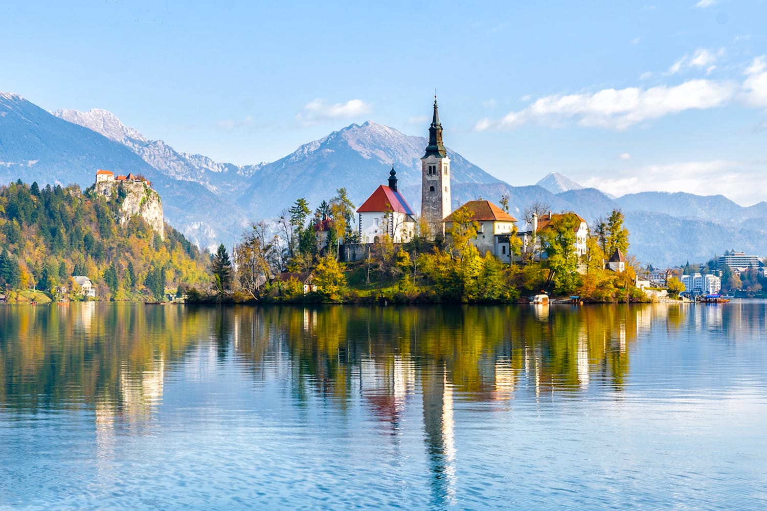 Lake Bled Slovenia. Beautiful mountain lake with small Pilgrimage Church. Most famous Slovenian lake and island Bled with Pilgrimage Church of the Assumption of Maria and Bled Castle in background.