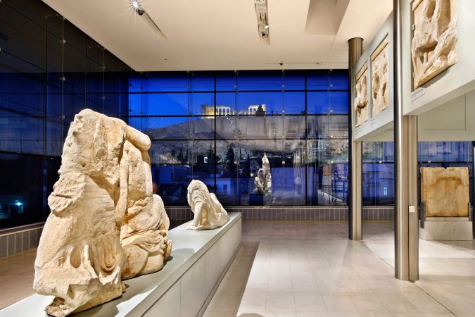 Inside view of the (new) Acropolis museum (part of the Parthenon gallery on the 3rd floor). In the background, through the glass you can see the Acropolis. Athens, Greece