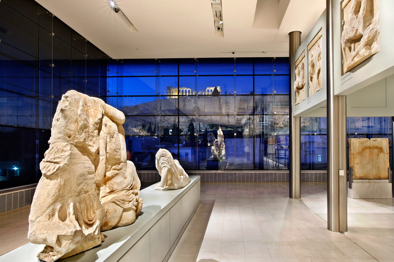 Inside view of the (new) Acropolis museum (part of the Parthenon gallery on the 3rd floor). In the background, through the glass you can see the Acropolis. Athens, Greece