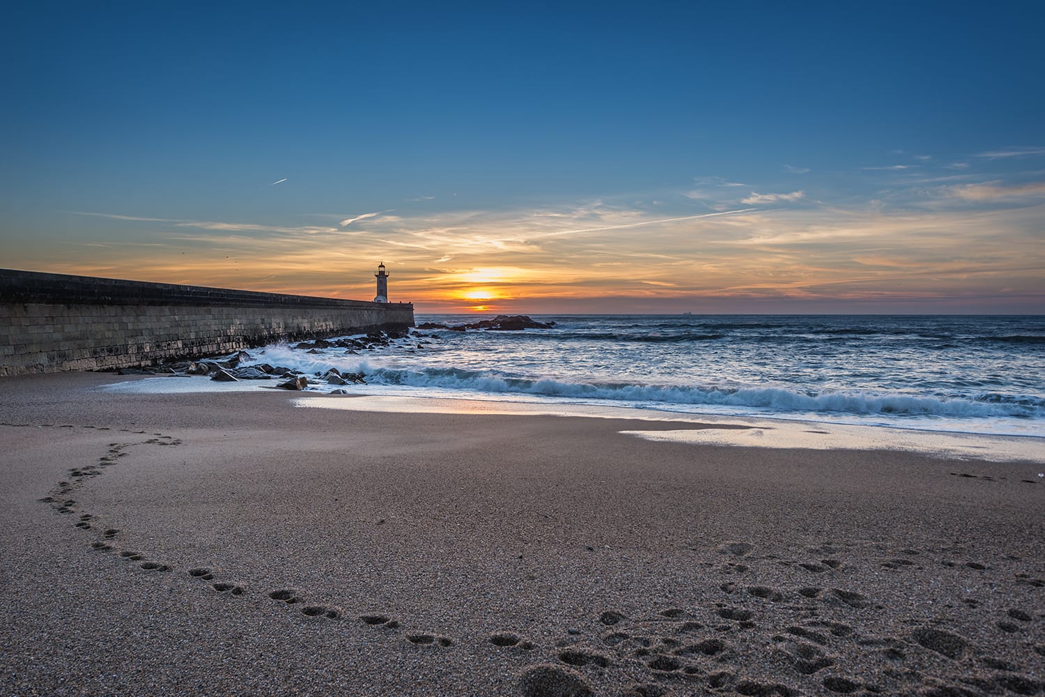Beach in Foz do Douro parish in Porto. View with breakwater and Felgueiras Lighthouse