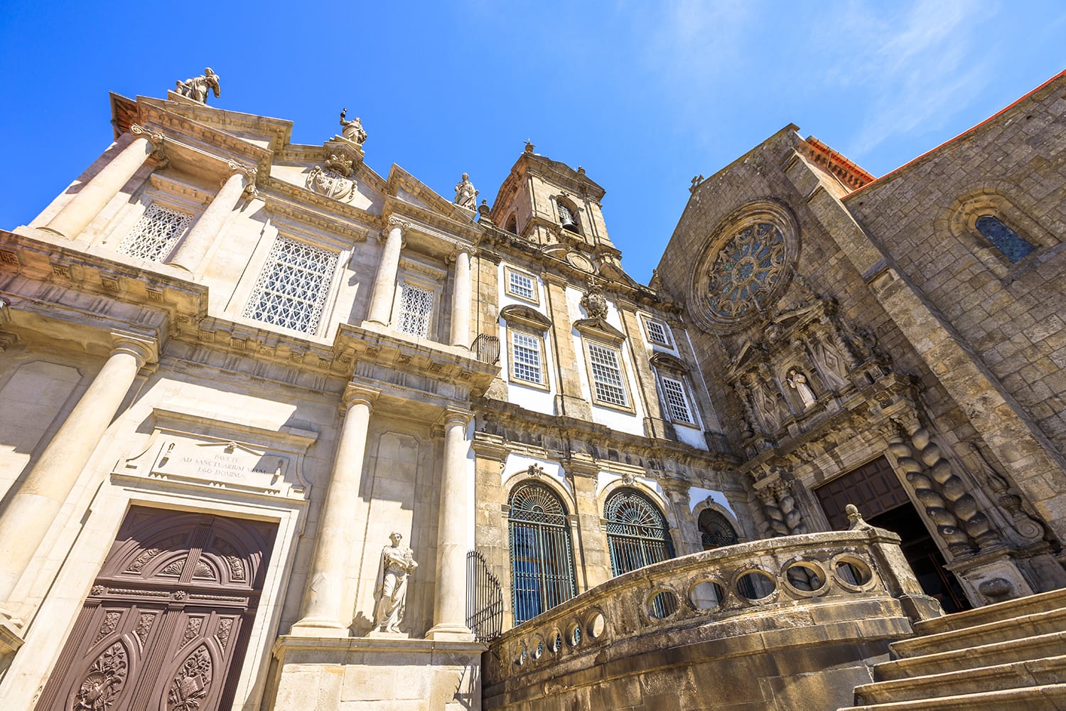 Prospective view of baroque main portal and gothic rose window of main facade of Church of Third Order of St. Francis or Igreja da Ordem Terceira de Sao Francisco. Ribeira district in Porto, Portugal