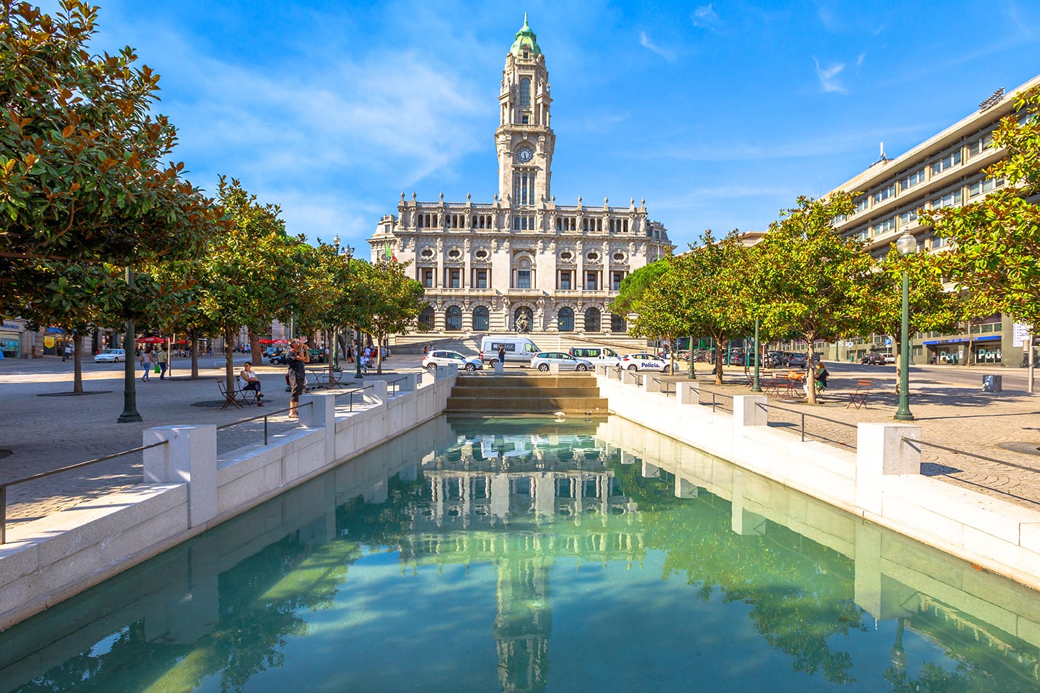 Porto City Hall or Camara Municipal do Porto water reflection in Avenida dos Aliados, Liberty square, Oporto in Portugal.