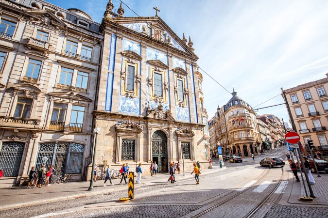 Street view on the facade with beautiful blue tiles of Congregados church in Porto city, Portugal
