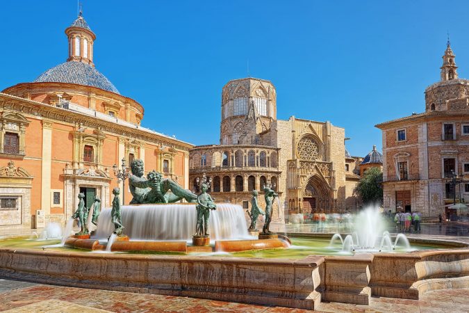 Fountain Rio Turia on Square of the Virgin Saint Mary, Valencia Cathedral, Basilica of Virgen the Helpless.