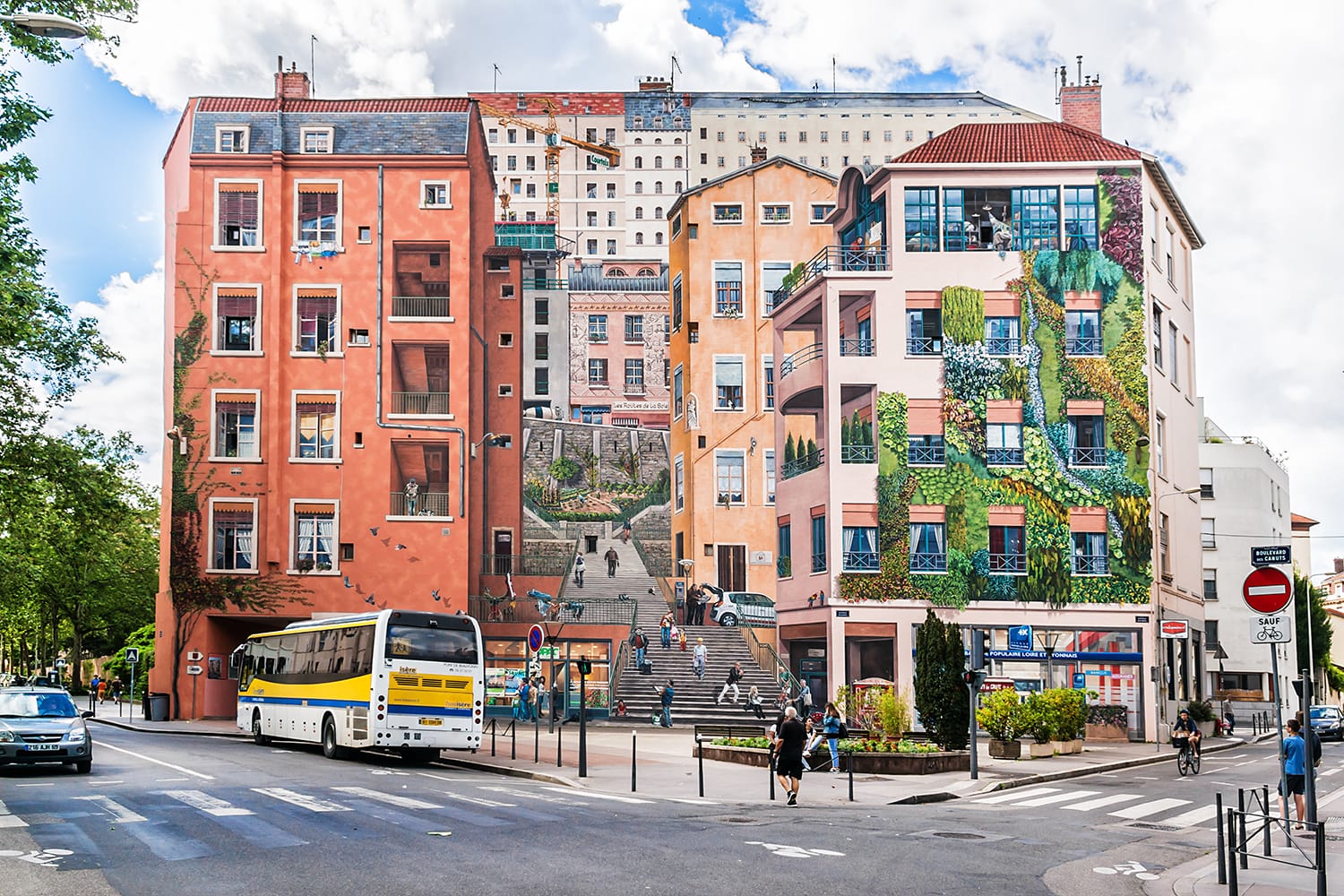 "Mur des Canuts" (1987) in the Croix-Rousse district. The huge mural is a realistic painting of a Lyon scene, part of the "Cite de Creation".
