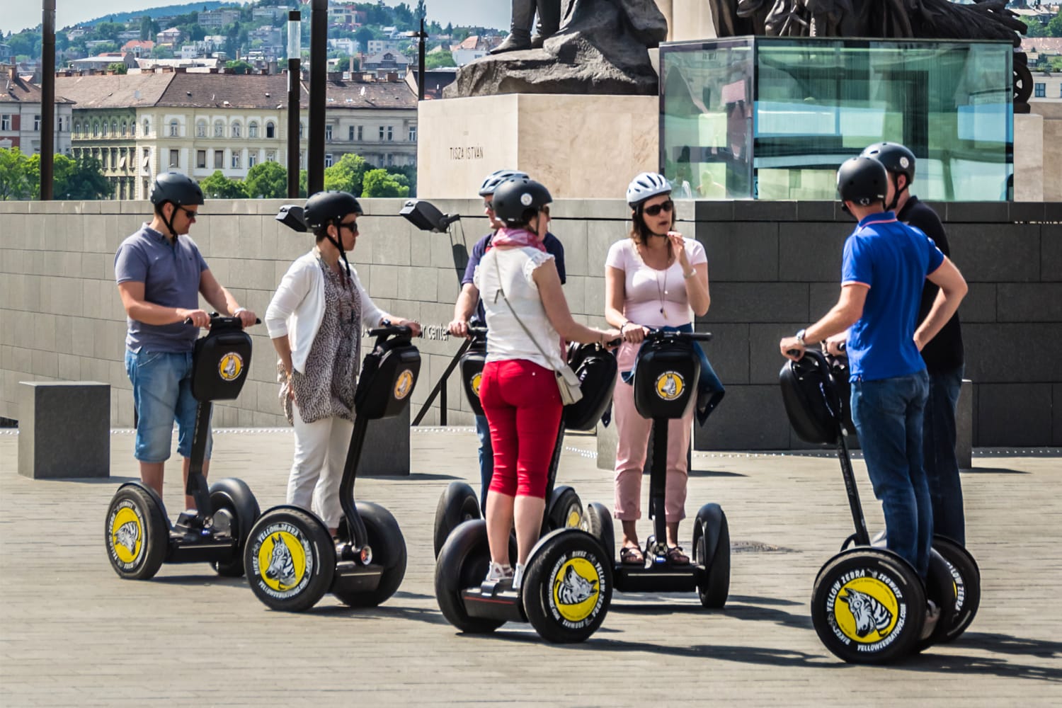 Group of tourists on Segway electric vehicles outside the Hungarian Parliament building in central Budapest, Hungary