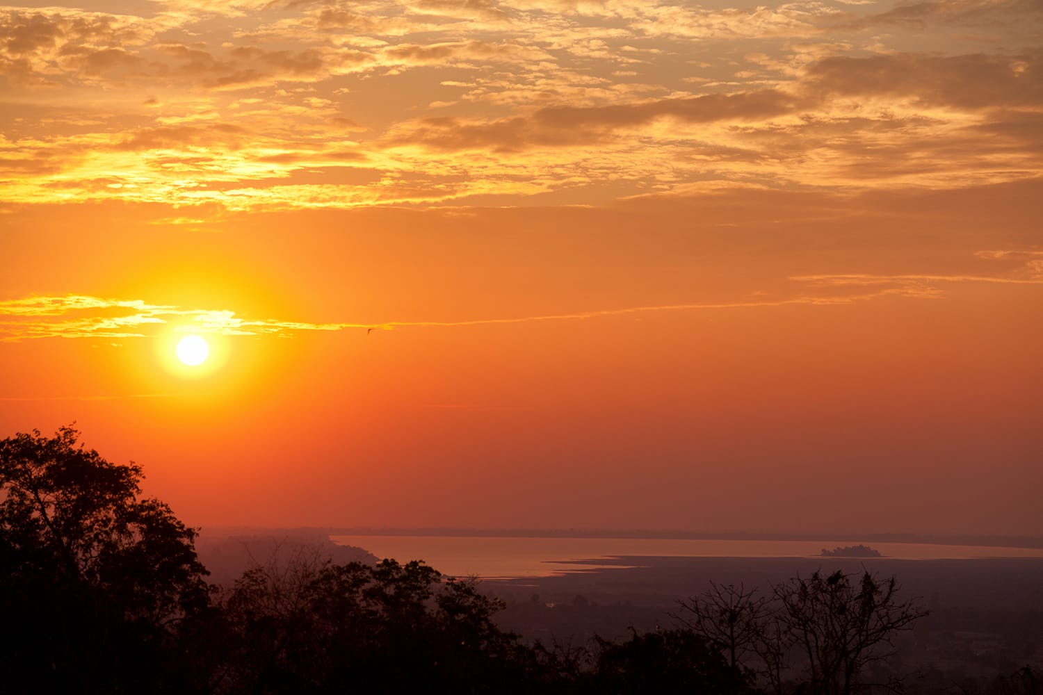 View of West Baray at Angkor Wat from Phnom Bakheng Temple at sunset. Cambodia