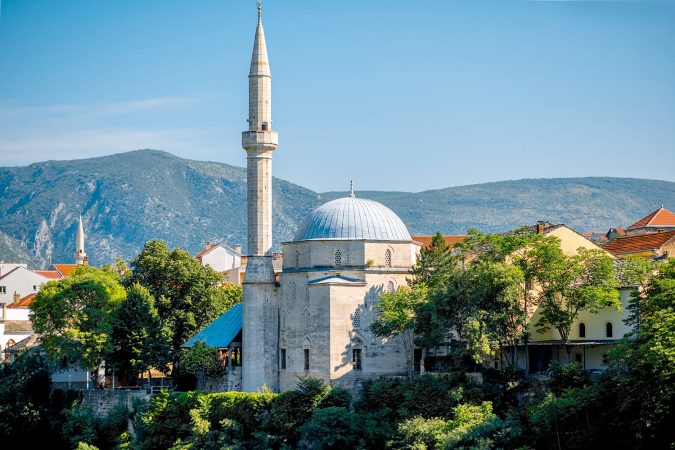 View on mosque from the old bridge in Mostar