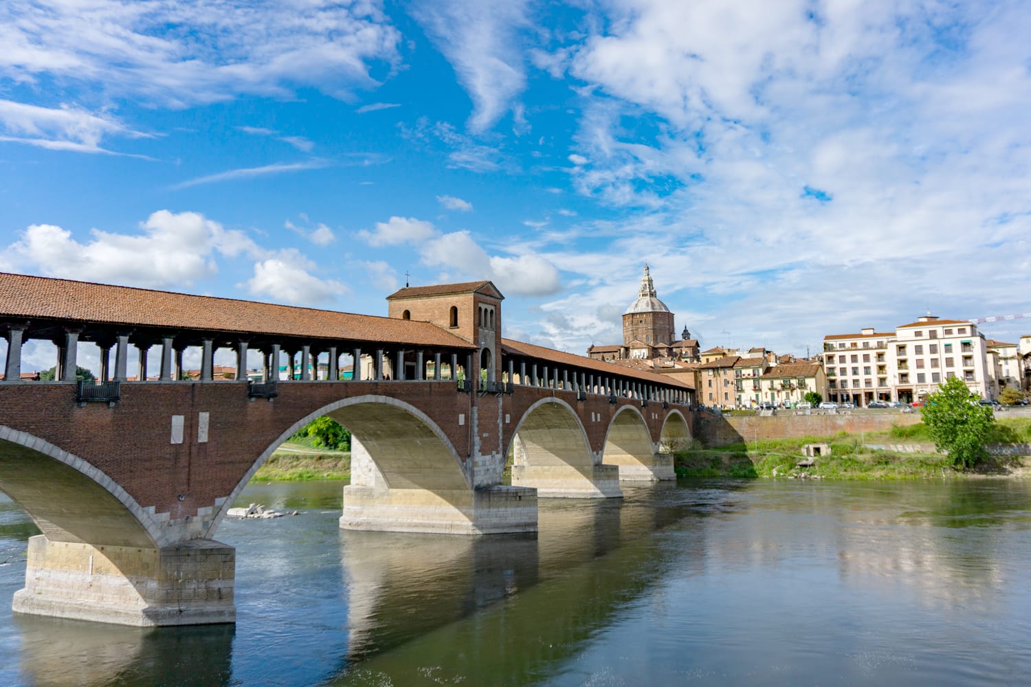 Ponte coperto ( covered bridge ) or Ponte Vecchio over Ticino river in Pavia, Lombardy, Italy