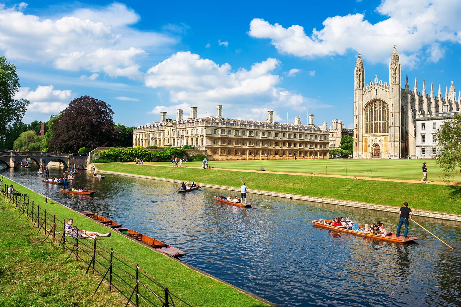 Tourists on punt trip (sightseeing with boat) along River Cam near Kings College in the city of Cambridge, United Kingdom