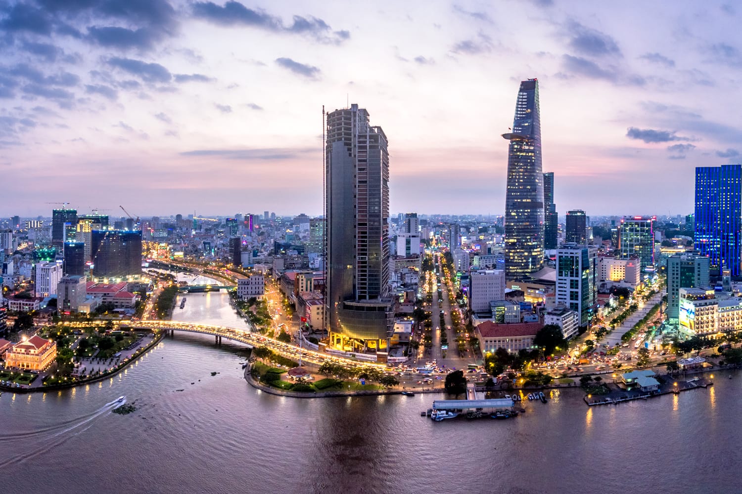 Top view aerial photo from flying drone of a Ho Chi Minh City with development buildings, transportation, energy power infrastructure. Financial and business centers in developed Vietnam.