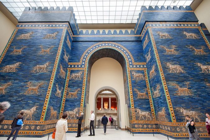 Tourists in front of Babylonian city wall at the Pergamon museum in Berlin, Germany