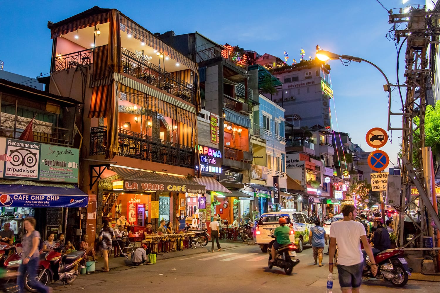 Evening Street with bars and pubs in the center of Ho Chi Minh city, Vietnam
