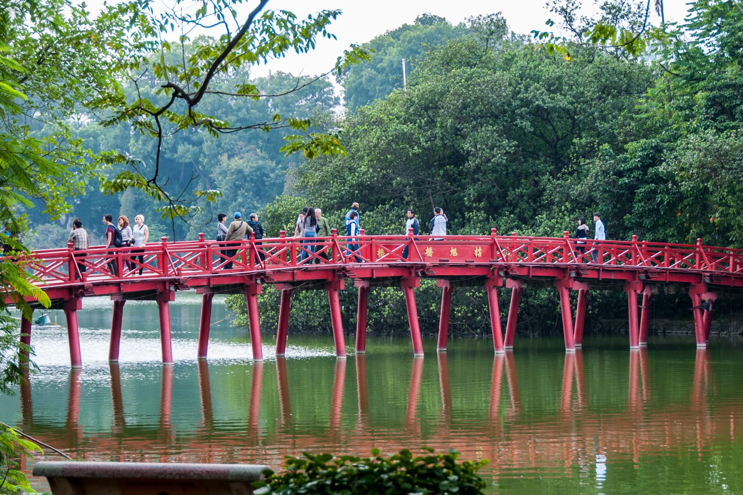 The Duc, a wooden bridge painted in red, which leads to the Ngoc Son Temple in Hanoi, Vietnam