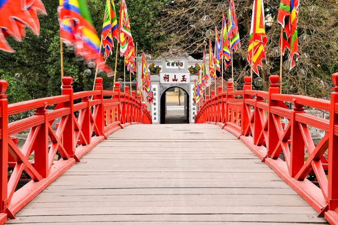 Red wooden Huc Bridge from the Ngoc Son Temple in Hanoi Vietnam