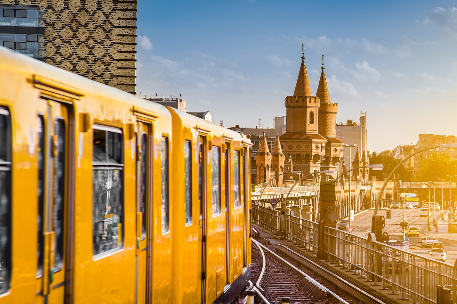 Panoramic view of Berliner U-Bahn with Oberbaum Bridge in the background in golden evening light at sunset with retro vintage Instagram style hipster filter effect, Berlin Friedrichshain-Kreuzberg