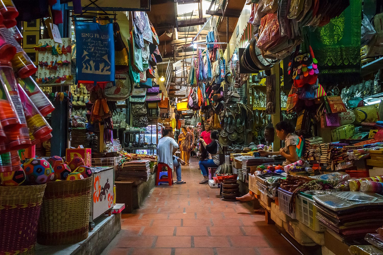 Several market vendors wait for customers in the Russian market in Phnom Penh, Cambodia