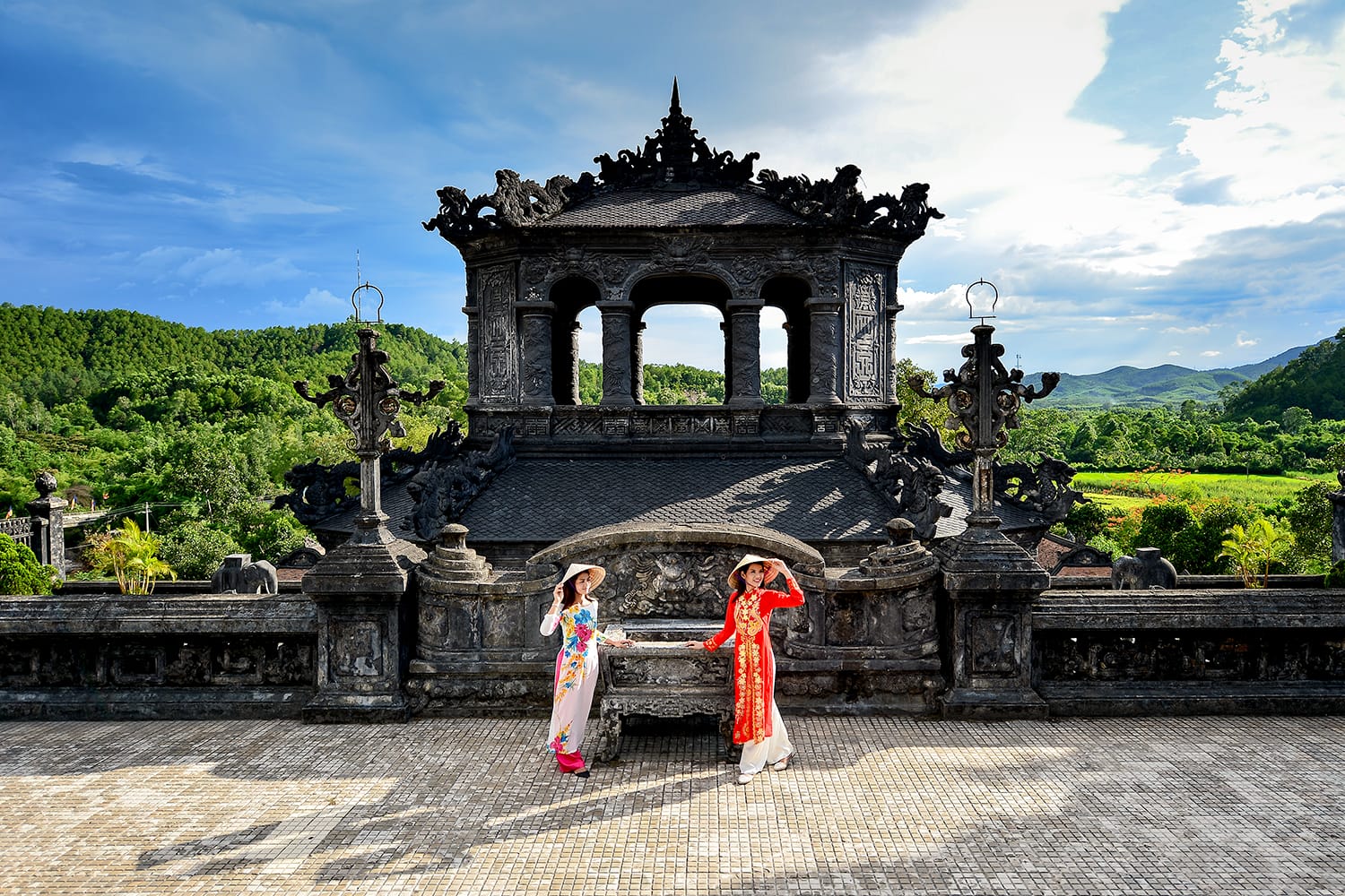 Beautiful woman with Vietnam culture traditional dress ,Grand stairs in Imperial Khai Dinh Tomb in Hue, Vietnam