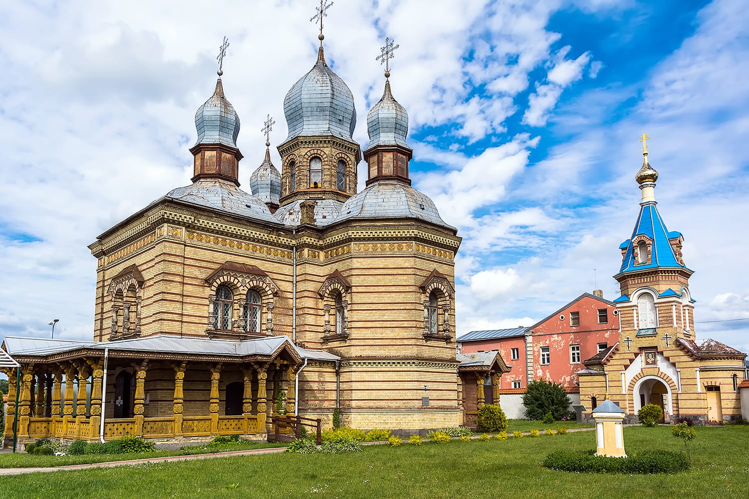 Jekabpils Orthodox Church of The Holy Spirit against bright blue sky. The church was built in the second part of the 19th century in Byzantine style. Its five domes have become a landmark of the city.